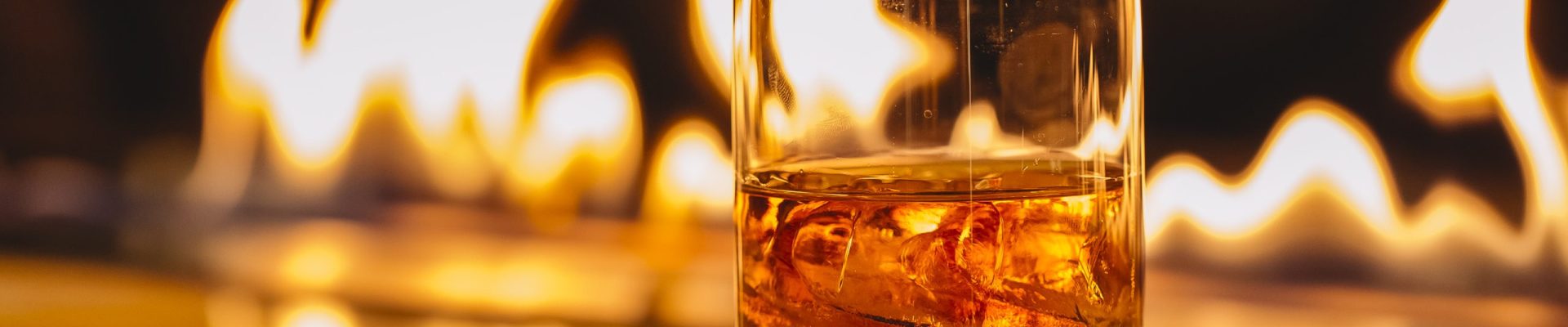 side view of glass of whiskey with ice on a background of a burning flame SSUCv3H4sIAAAAAAAACpyRwW7DIAyG75P2DhHnRgpNG6V9lWoHB9wElUIFZNNU9d1nIFScd8Of7d/+zfPzo2nYBF4Jdm6eMaJYab364CAoawh3u407NBJdTVCqYJ0CXcMJglgM3JGgWbWO+JWSzAcIq0cfh21IQMCZNDJ8S+SNLjluSiIlqYNSjO0q5tcpsYKy+L868+OruIEZjfhNC1dGHGqEbOSSS9ntJ6C719ZglcpWrr6tAB0L+krp4ZRQZq7abFjSlUubsKsJLq7w3pxpax8w6XjiK2li4Qt4T+Wy8GqQoD+192qOsSEZ2FSZpJ+IIe/3PT/uh3HkYz8MnB+2gvx7iyKdtE4RoljclKytq7gBm45yPHbjqeUTDu2h67p2lD22pytKyTt5QiHp8K8/AAAA//8DAFWmtZSHAgAA