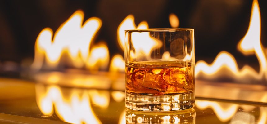 side view of glass of whiskey with ice on a background of a burning flame SSUCv3H4sIAAAAAAAACpyRwW7DIAyG75P2DhHnRgpNG6V9lWoHB9wElUIFZNNU9d1nIFScd8Of7d/+zfPzo2nYBF4Jdm6eMaJYab364CAoawh3u407NBJdTVCqYJ0CXcMJglgM3JGgWbWO+JWSzAcIq0cfh21IQMCZNDJ8S+SNLjluSiIlqYNSjO0q5tcpsYKy+L868+OruIEZjfhNC1dGHGqEbOSSS9ntJ6C719ZglcpWrr6tAB0L+krp4ZRQZq7abFjSlUubsKsJLq7w3pxpax8w6XjiK2li4Qt4T+Wy8GqQoD+192qOsSEZ2FSZpJ+IIe/3PT/uh3HkYz8MnB+2gvx7iyKdtE4RoljclKytq7gBm45yPHbjqeUTDu2h67p2lD22pytKyTt5QiHp8K8/AAAA//8DAFWmtZSHAgAA